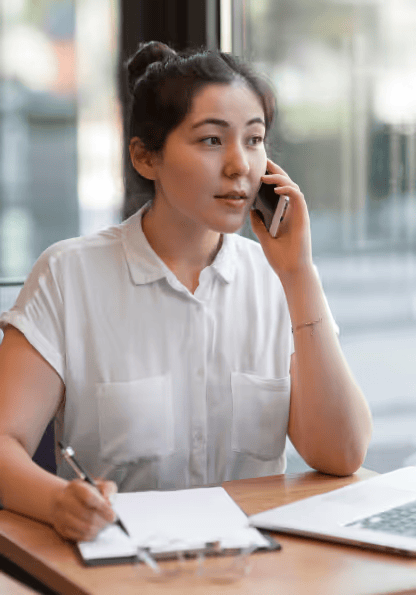Person writing at a desk